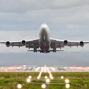 Airplane taking off from Manchester Airport representing income, cost and capacity modelling forecasting